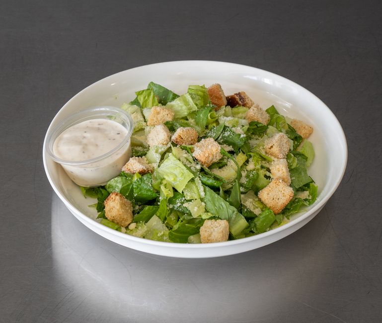 Fresh Caesar salad with croutons and dressing, perfect for a healthy meal.